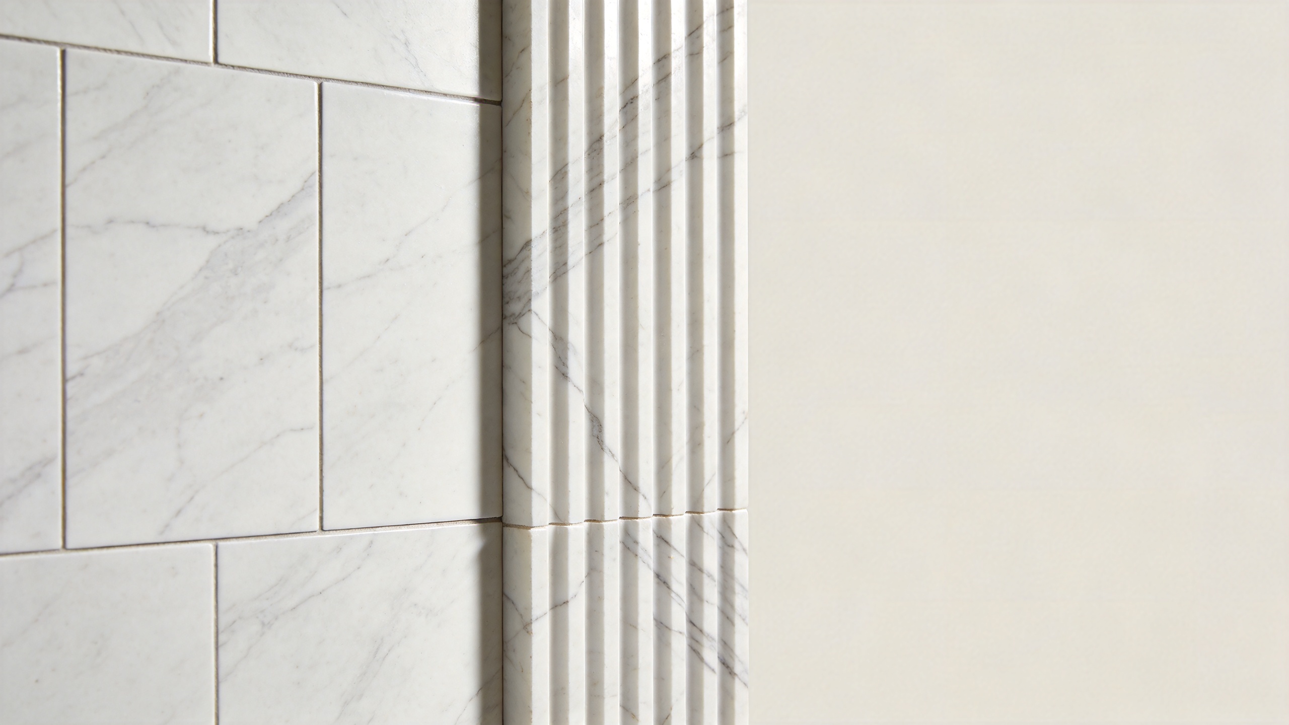 Comparison of modular wall marble tile and fluted marble wall panels