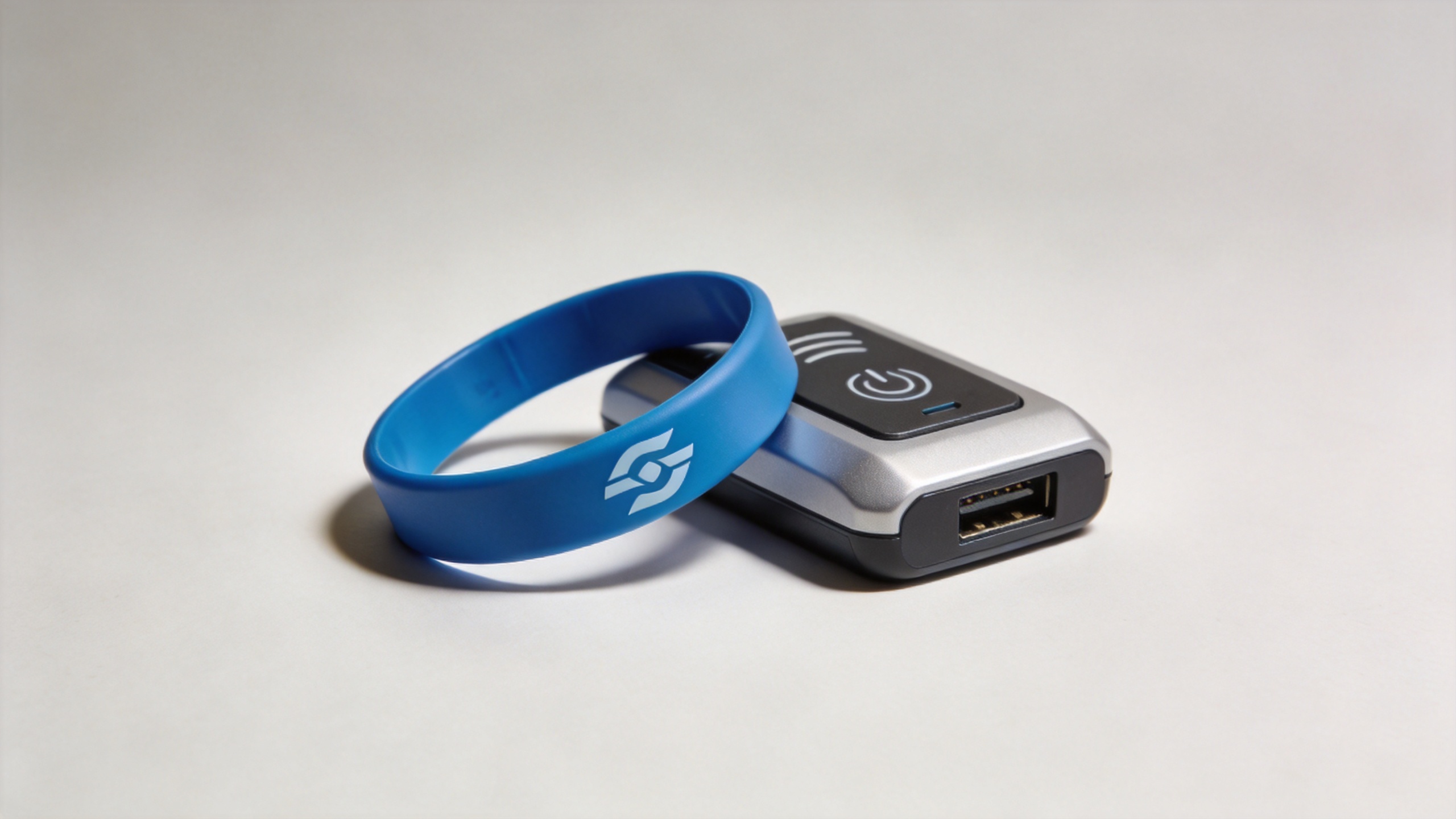 Silicone custom RFID wristbands beside an access control reader