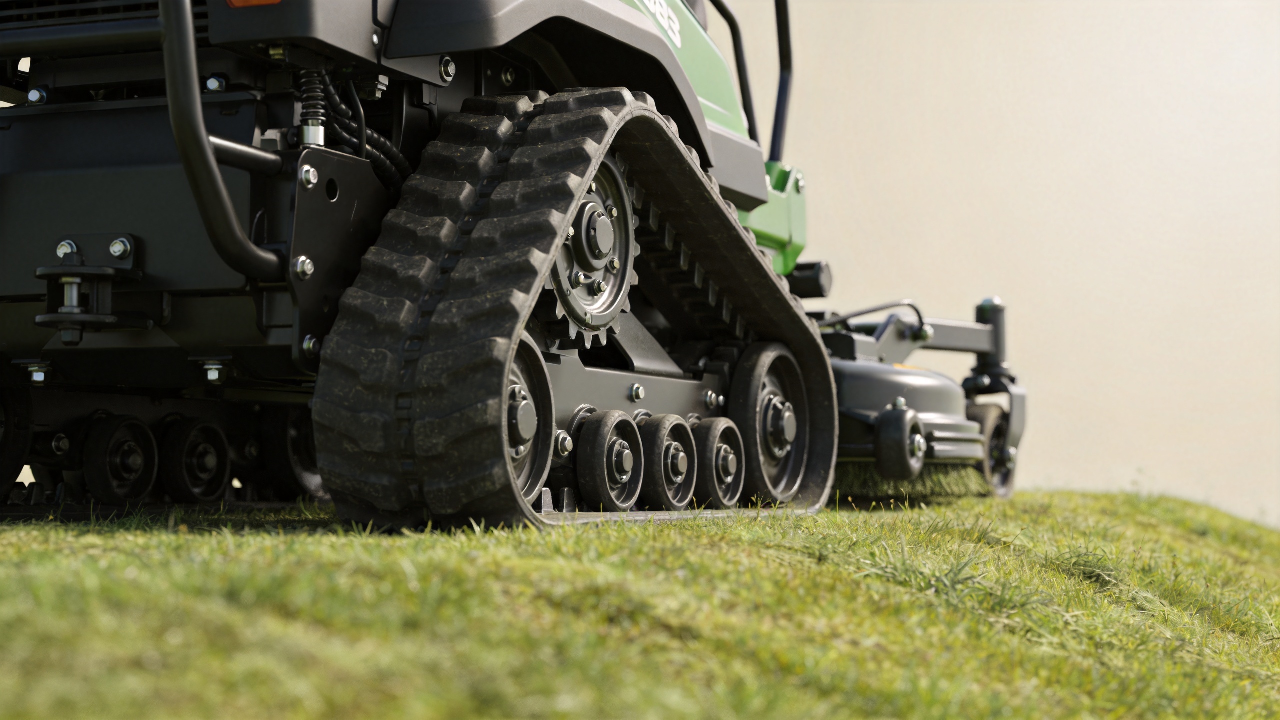 Tracked lawn mower rubber tracks and undercarriage inspection