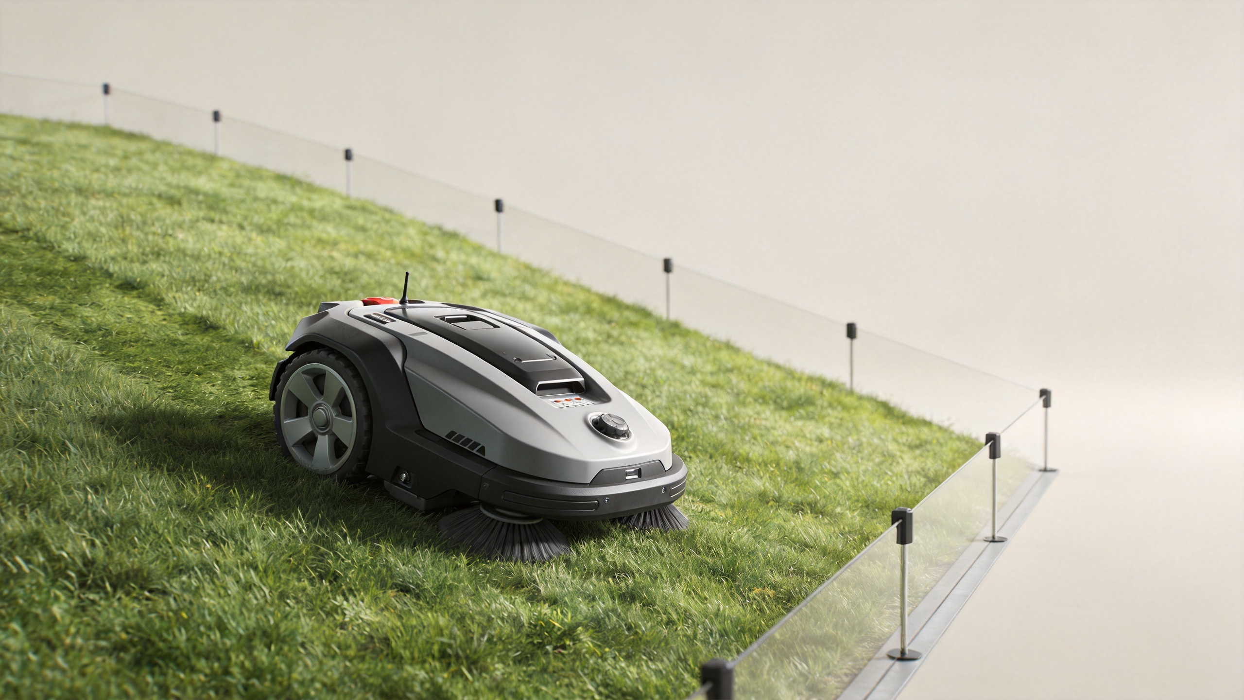 Robot lawnmower operating on a managed grassy slope