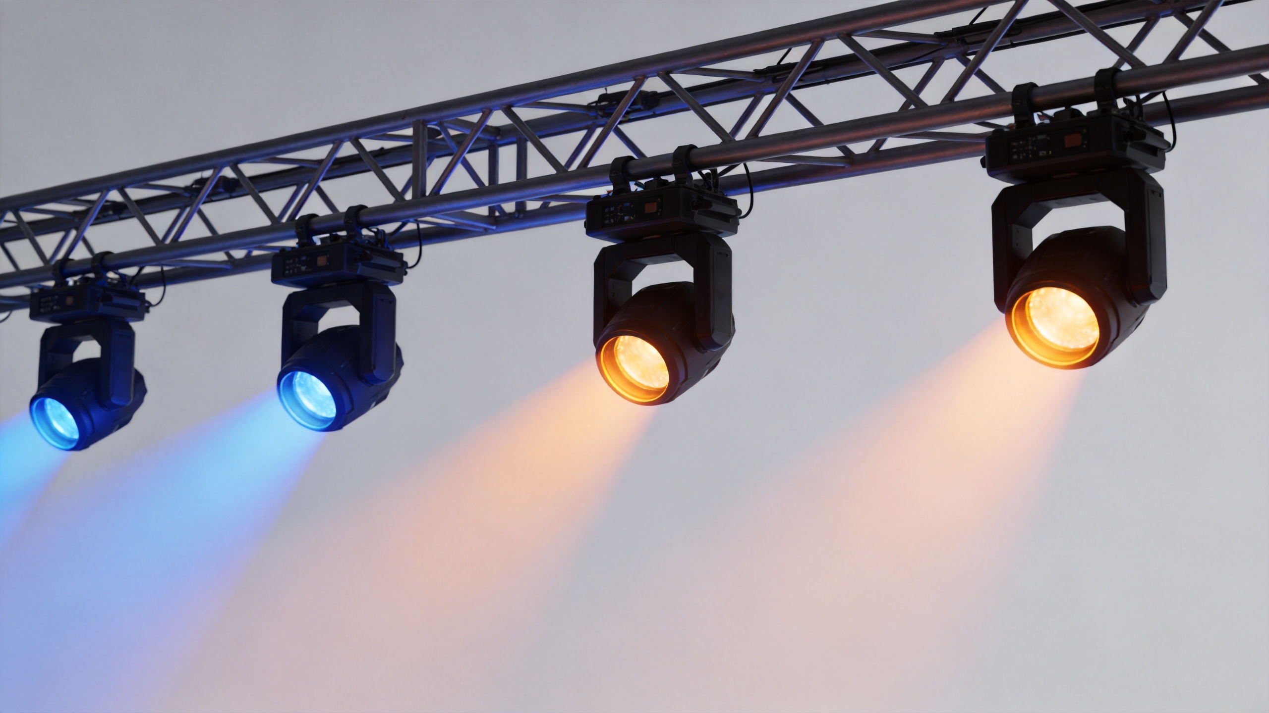 Concert lighting moving-head fixtures creating coordinated stage beams