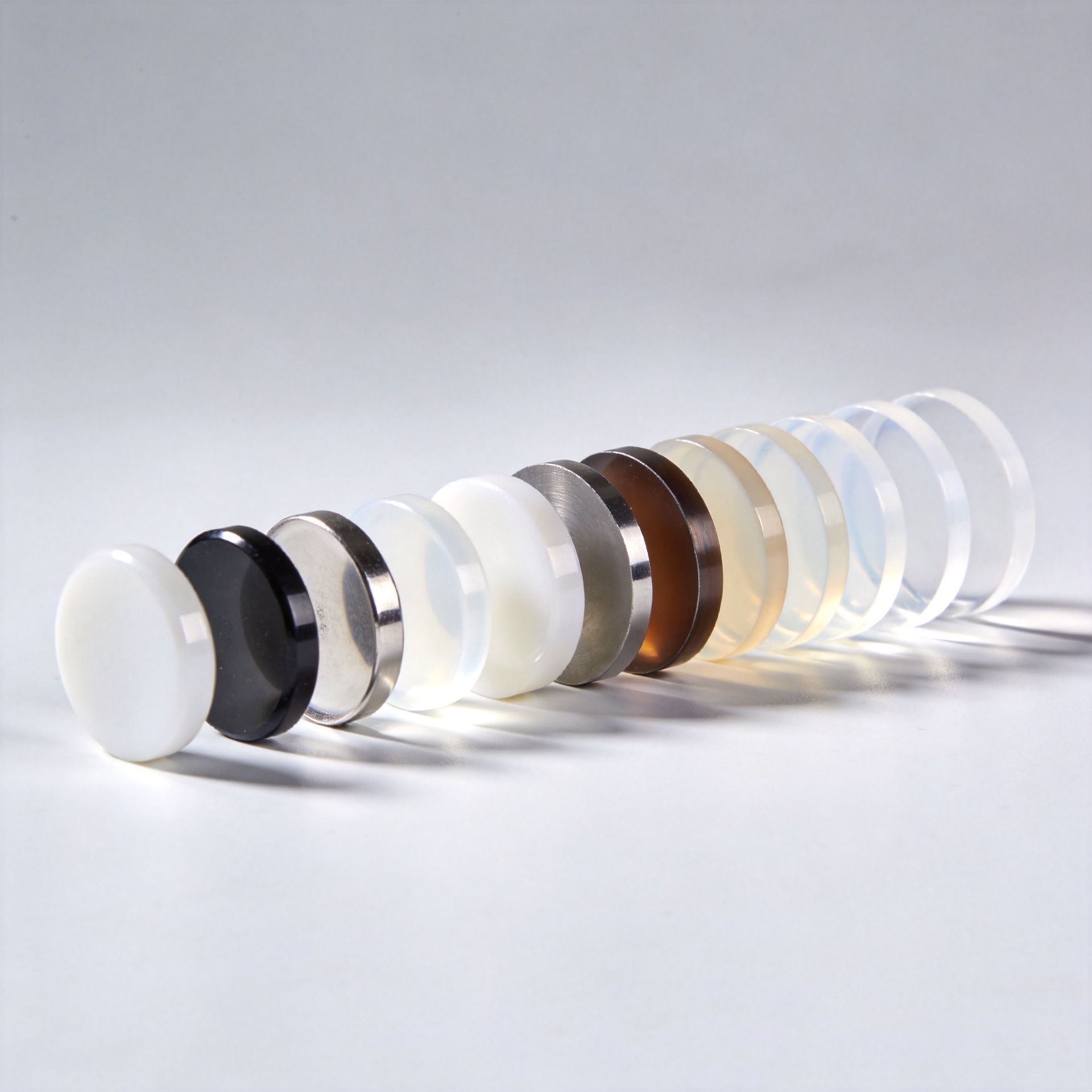 Different types of zirconia discs including monochromatic and multilayer gradient variants for dental restoration