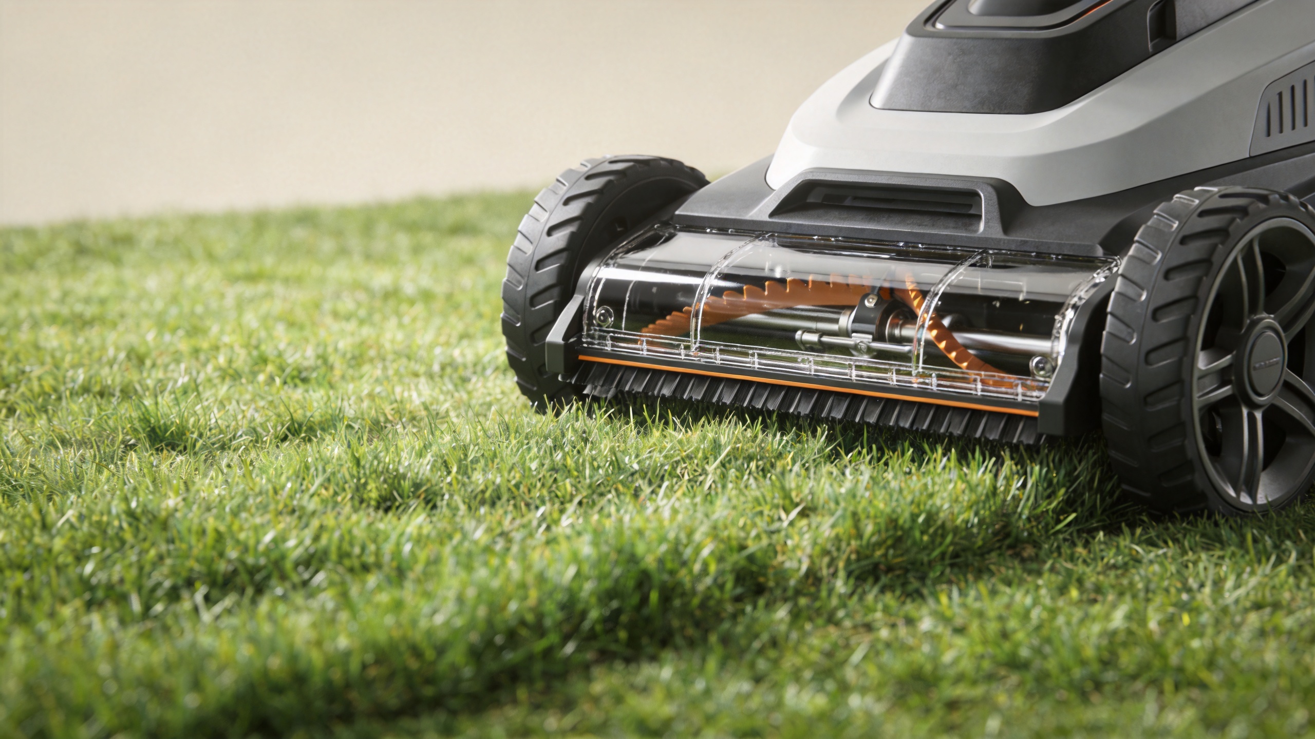 Cordless lawn mower cutting deck on a residential lawn