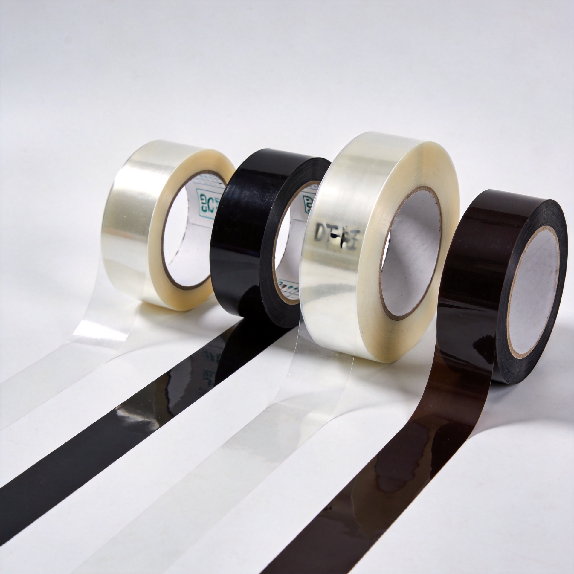 DTF PET film rolls of different widths arranged for comparison, showing 30cm and 60cm options