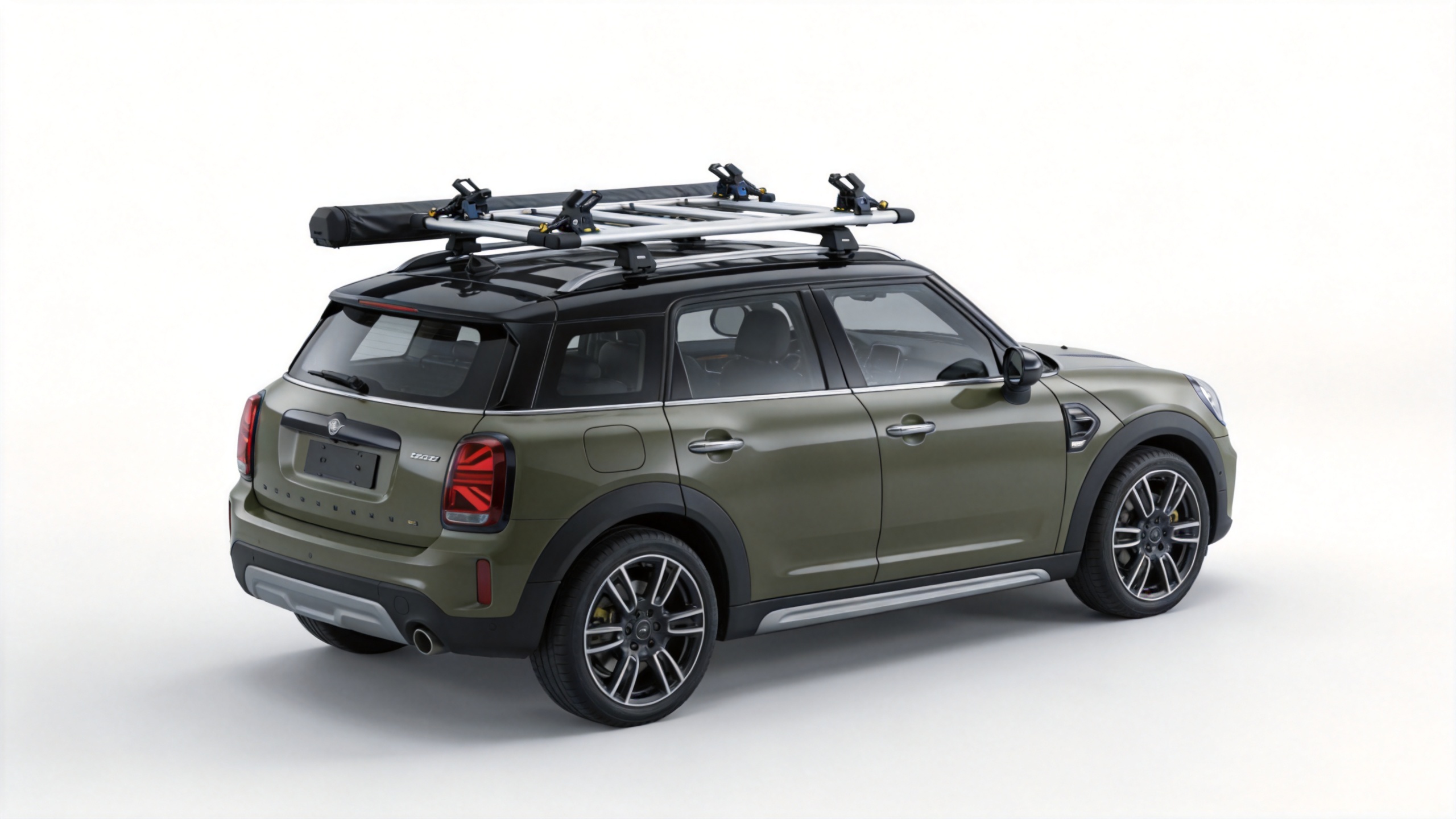 Aftermarket roof rack crossbar system on a small SUV for hard shell rooftop tent mounting