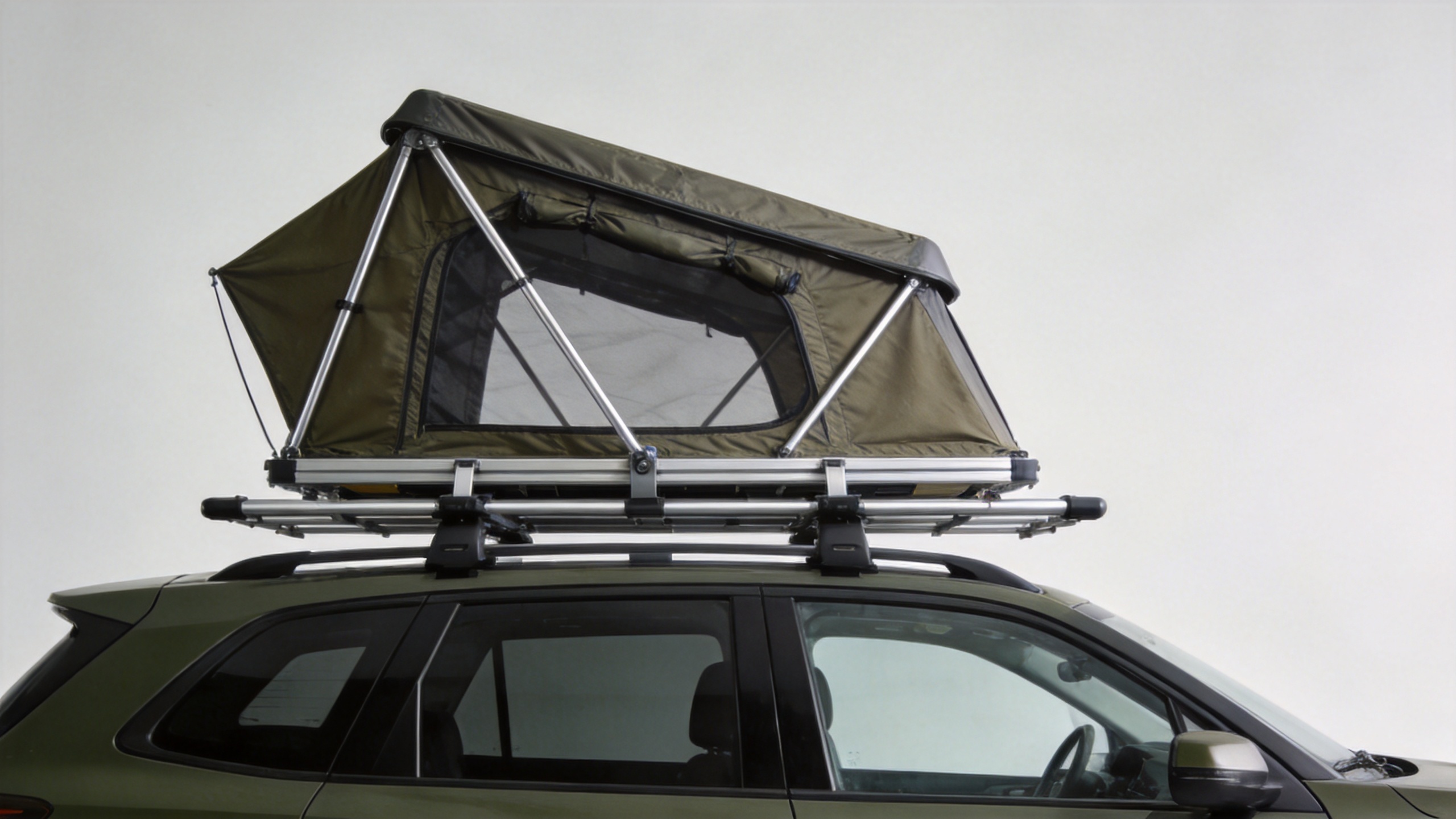 Roof rack tent mounted on SUV roof rack