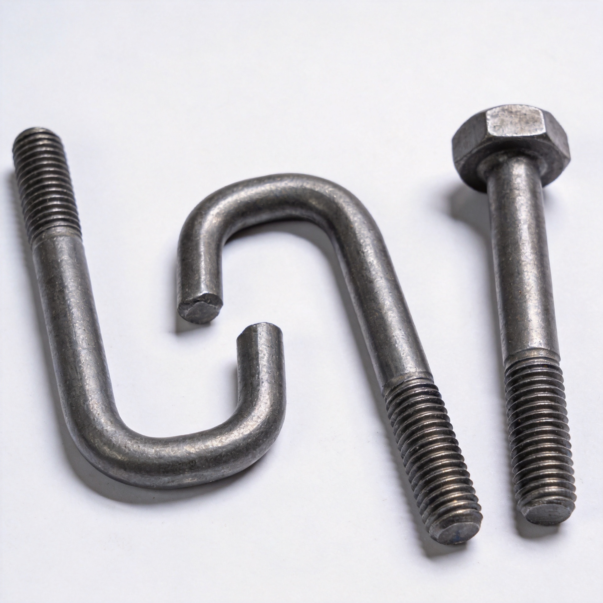 Various anchor bolt types including L-bolt, J-bolt, and headed anchor bolt on white background