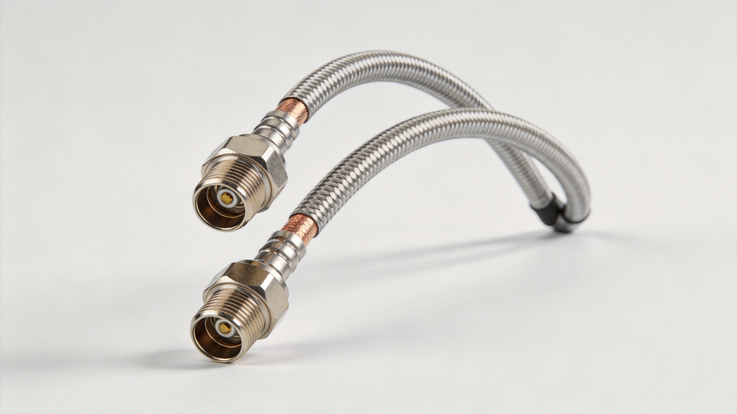 Semi-rigid coaxial cable assembly with SMA connectors showing formed bend for installation