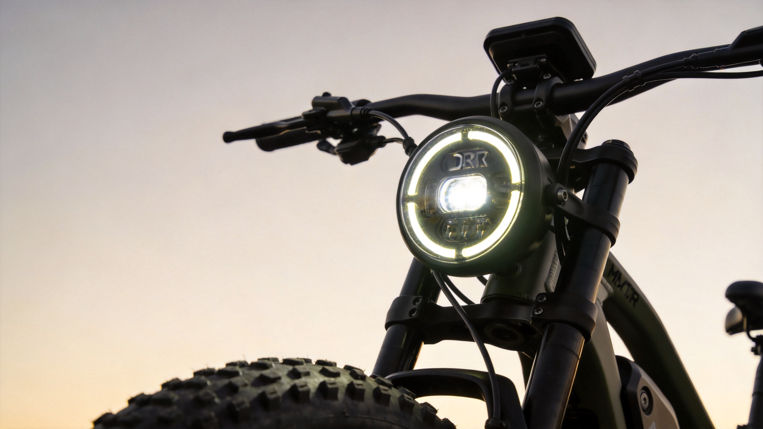 Halo DRL headlight on electric mountain bike for trail safety visibility