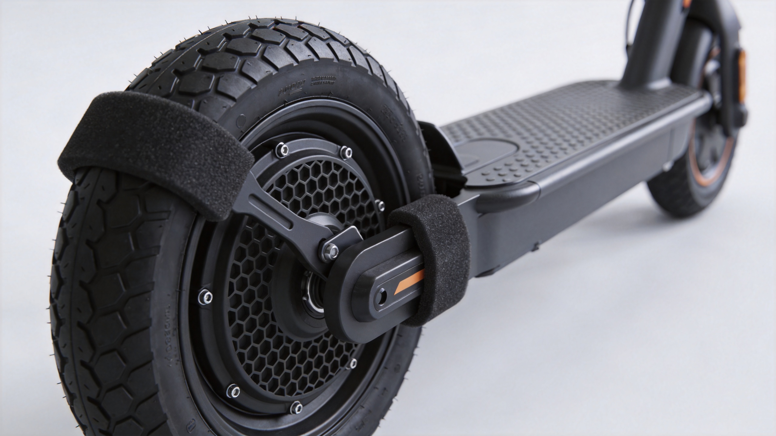 Electric scooter solid tire being fitted to a wheel with rim-protecting tools