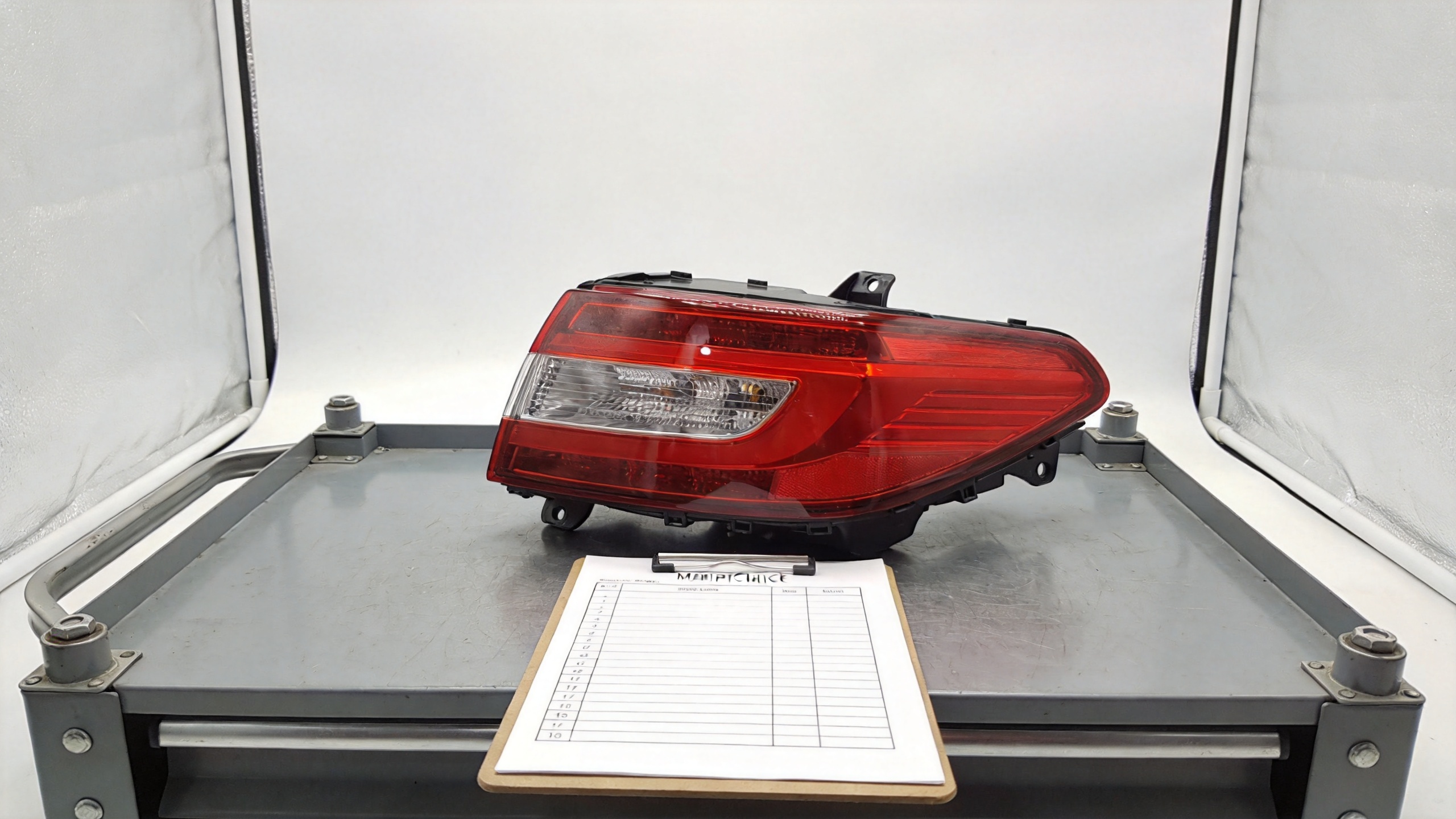 LED tail light assembly being checked for vehicle fitment