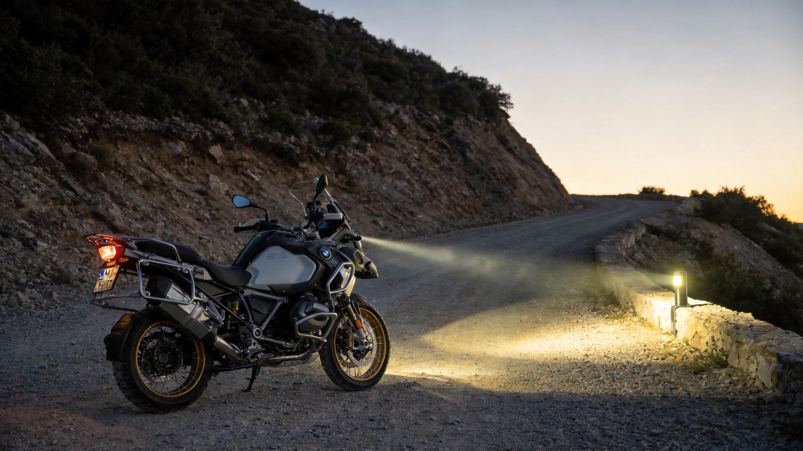 Motorcycle driving lights LED supporting an adventure motorcycle on a gravel route